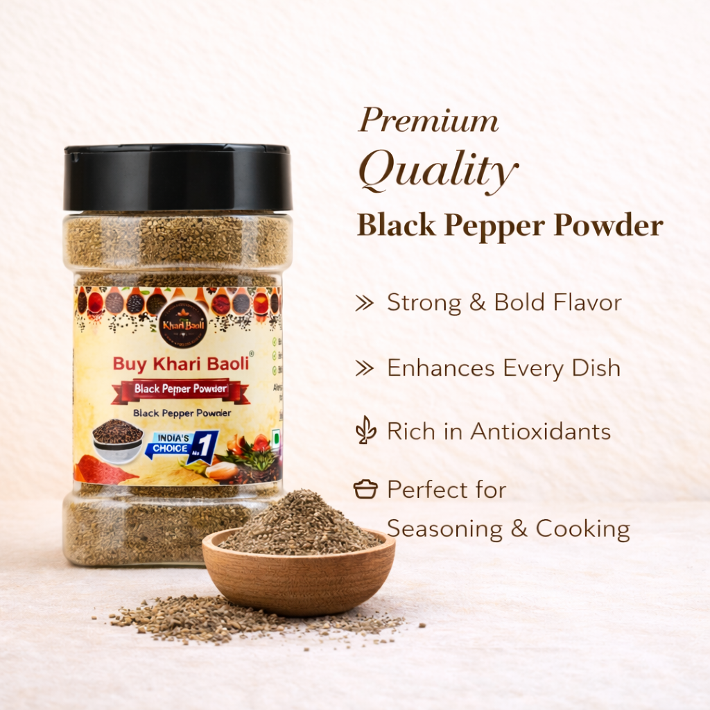 Jar of black pepper powder with a scoop of powder on a light background
